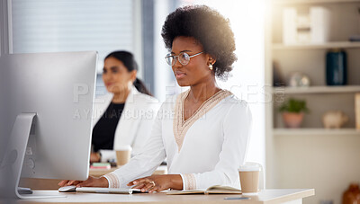 Buy stock photo Serious black woman, computer and working in focus checking corporate database or finance at office desk. African American female sitting by desktop PC for email or communication at the workplace
