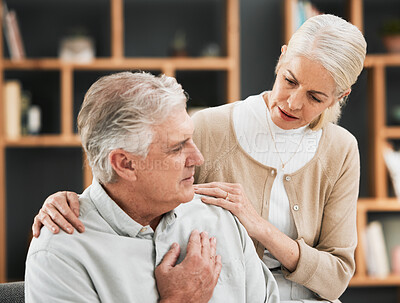 Buy stock photo Heart attack, woman stress and senior couple at home with cardiology problem or stroke. House, marriage and retirement of a man with emergency and health issue in a living room with female support