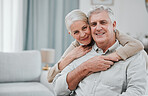 Portrait, love and mockup with a senior couple hugging in the living room of their house together. Smile, space or trust with a happy mature man and woman bonding while enjoying retirement at home