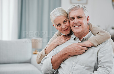 Buy stock photo Portrait, love and mockup with a senior couple hugging in the living room of their house together. Smile, space or trust with a happy mature man and woman bonding while enjoying retirement at home