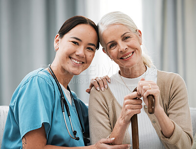 Buy stock photo Nurse, senior woman and sofa for portrait, walking stick and smile together with happiness, chat and care. Elderly patient, asian doctor and couch with helping hand, happy and connection for support