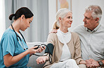 Nurse, doctor or old couple with blood pressure test consulting in hospital to monitor heart wellness. Healthcare, hypertension consultation or medical physician with a happy patient for examination