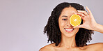 Face portrait, skincare and black woman with lemon in studio isolated on a gray background mock up. Nutrition, cosmetics and happy female model with fruit food for vitamin c, diet or healthy skin.