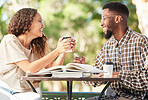Black couple, coffee and happy outdoor on a date while studying, talking and bonding at table. Man and woman students with a drink or tea to relax, study and talk about love and care at cafe or shop