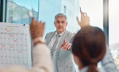 Buy stock photo Senior businessman, coaching and question in team presentation for collaboration or engagement at office. Elderly male CEO leader or coach training staff with hands raised in FAQ, teamwork or meeting