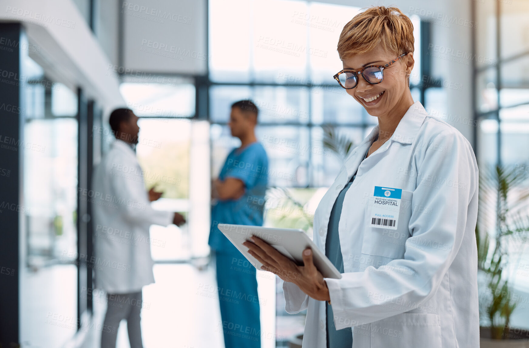 Buy stock photo Woman, doctor and tablet in healthcare research at hospital for innovation, software or schedule planning. Happy female medical professional on touchscreen in online search, browsing or communication
