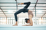 Fitness, gymnastics and flexibility with a black woman training in a gym for an olympics competition. Exercise, workout and balance with a female gymnast in a studio to practice for her performance