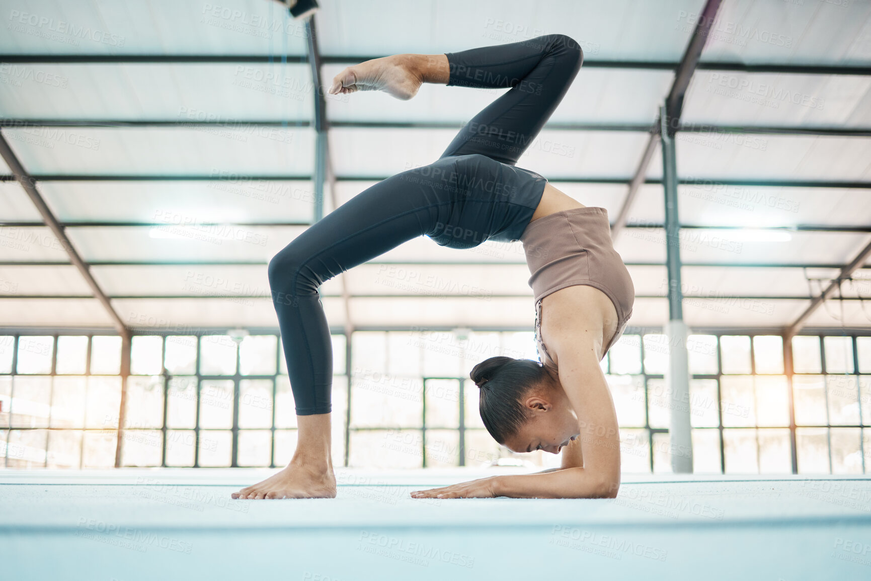 Buy stock photo Fitness, gymnastics and flexibility with a black woman training in a gym for an olympics competition. Exercise, workout and balance with a female gymnast in a studio to practice for her performance