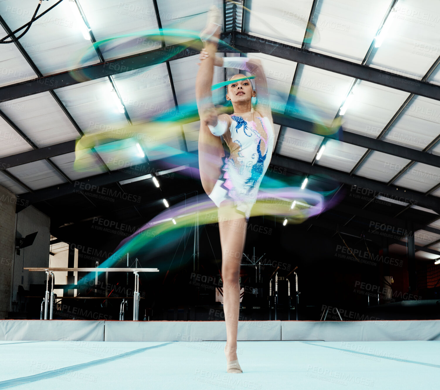 Buy stock photo Creative, ribbon and motion blur with a woman gymnast in a studio for olympics dance training or exercise. Fitness, art and gymnastics with a female dancer in a gymnasium for rhythmic practice