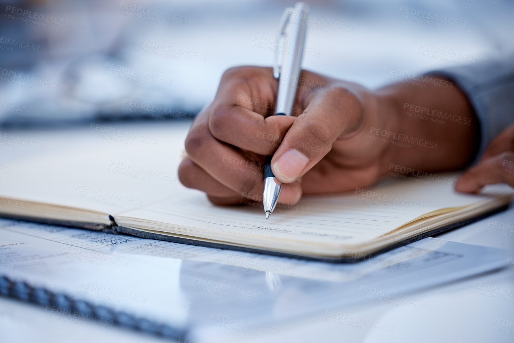 Buy stock photo Business, black man and hands writing in notebook, diary and strategy ideas. Closeup worker planning with pen, notes and schedule of information in journal, reports or logistics agenda at office desk