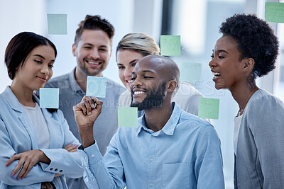 Buy stock photo Business, team and black man writing on sticky note, brainstorming and planning for project, smile and collaboration. Corporate, Nigerian male leader or staff share ideas, advertising agency or sales