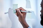 Black man, hands and writing for schedule planning, brainstorming or tasks on glass board at office. Hand of African American male with pen to write project plan, post it or sticky note for strategy