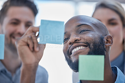 Buy stock photo Black man, writing and smile for schedule planning on glass board for team brainstorming or tasks at office. Happy African male smiling in project plan, ideas or sticky note for teamwork strategy