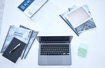 Laptop, document and tablet screen mockup above on table for business schedule, planning or design at office. Top view of computer, books and diary of tools or equipment for project plan or marketing