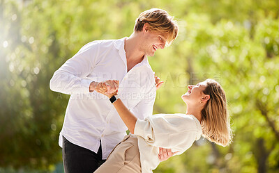 Buy stock photo Couple, dance and love in park, garden and nature for love, romantic care and happiness together. Happy man, young woman and dancing outdoor in sunshine, summer date and celebration of valentines day