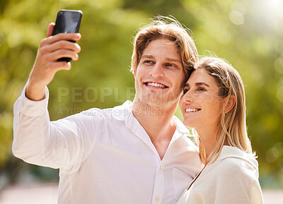 Buy stock photo Couple, selfie and smile in park for love, care and happiness together in garden or nature for social media. Happy man, young woman and take photograph outdoor for holiday, date and relax in summer