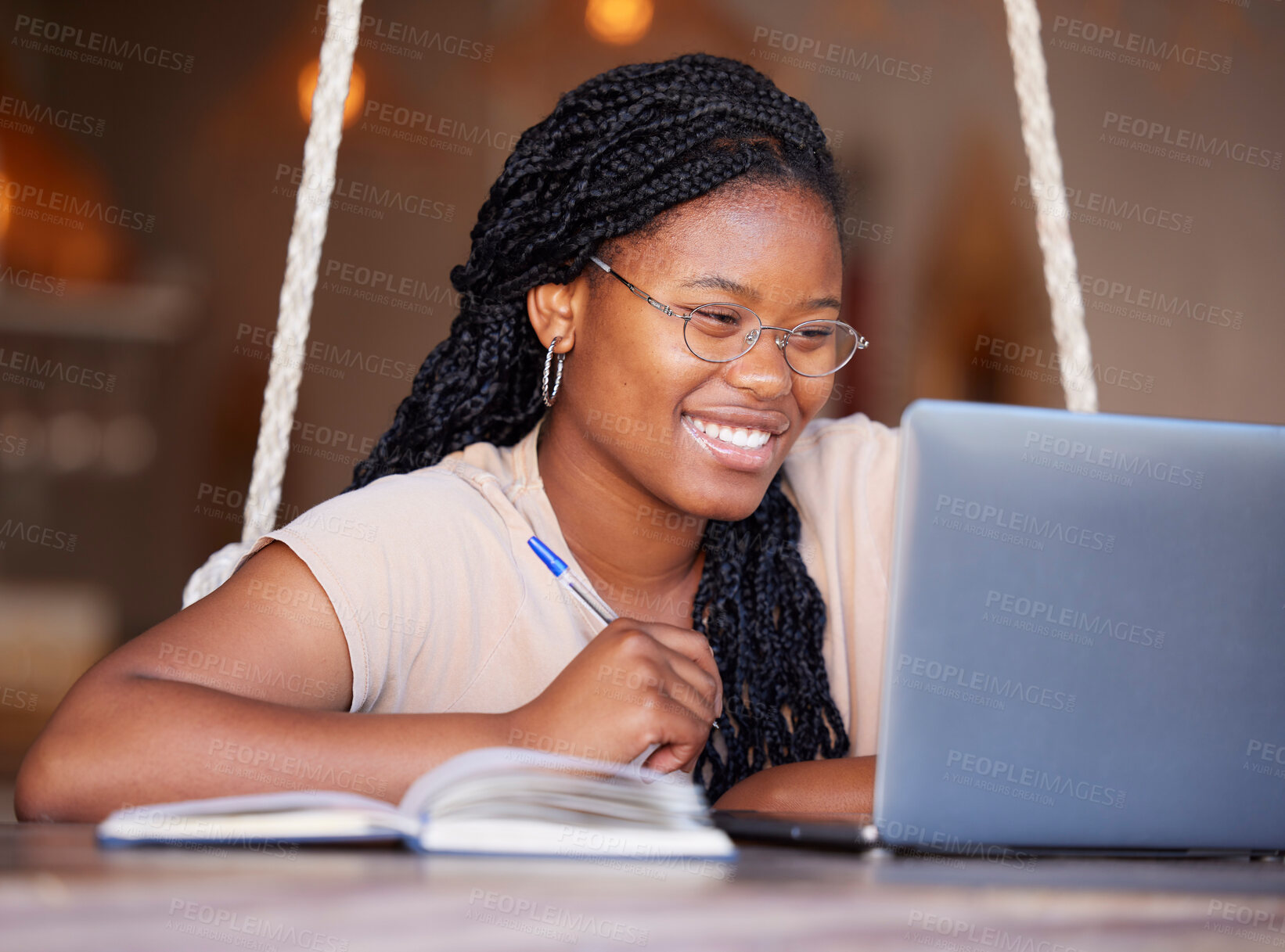 Buy stock photo Happy, class and black woman doing elearning on a laptop, studying and learning with notes. Education, smile and African home student doing online work, homework and preparing for an exam on a pc