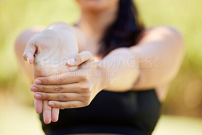 Buy stock photo Closeup, hands and woman stretching in nature for fitness, yoga and cardio workout on blurred background. Zoom, hand and wrist stretch for girl warm up in countryside for run, meditation or pilates