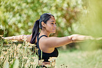 Balance, stretching and yoga by woman in nature for wellness, training and cardio on blurred background. Arm, stretch and girl relax in pilates, mediation and exercise in countryside, zen and peace