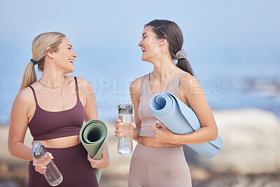 Buy stock photo Women friends, fitness and water at beach while talking, happy and together for exercise. Happy people outdoor on blue sky for funny communication, motivation and laughing for morning workout bottle