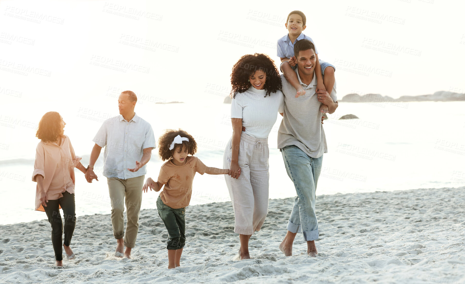 Buy stock photo Latino family, beach and walking on summer vacation, quality time and bonding for fun and wellness. Grandparents, mother and father with children, seaside holiday and travelling for adventure and joy