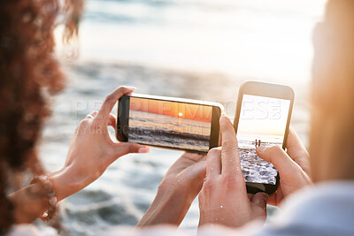 Buy stock photo Phones, beach and couple taking a picture of the sunset while on summer vacation or weekend trip. Technology, adventure and hands of man and woman with cellphones taking photo by the ocean on holiday