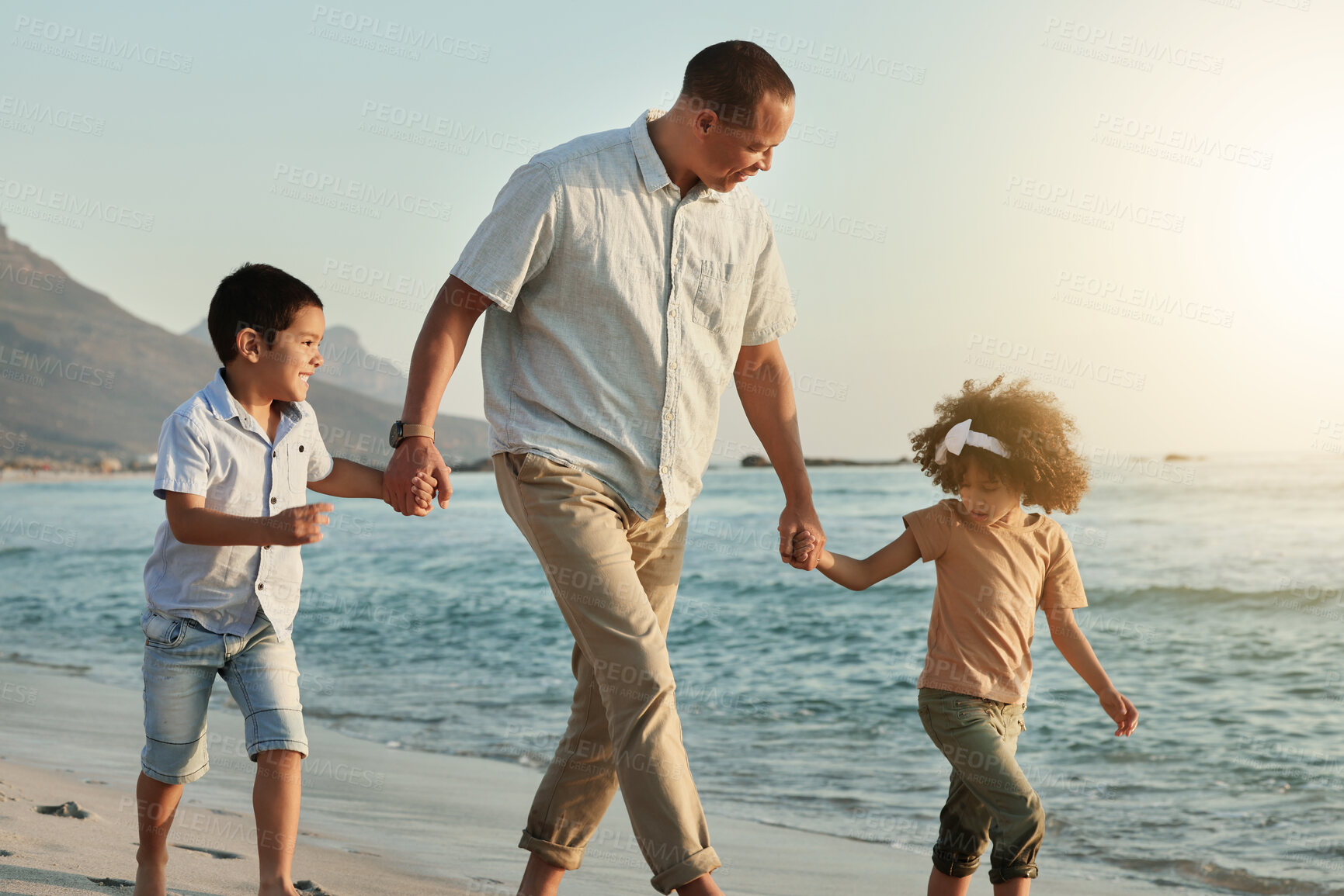 Buy stock photo Holding hands, children and grandfather walking on beach, having fun or bonding outdoors. Love, care and happy grandpa with kids, boy and girl by ocean or seashore enjoying holiday vacation at sunset