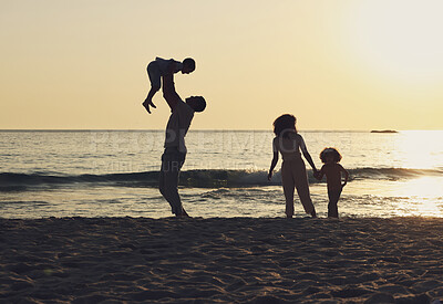 Buy stock photo Sunset, playing and travel with family at beach for freedom, happiness and summer break on vacation. Relax, calm and holiday trip with parents and children enjoying bonding, quality time and care