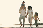 Happy, holding hands and walking family on the beach for travel, bonding and quality time in Brazil. Smile, together and parents with children on a walk by the ocean for playing, vacation and break