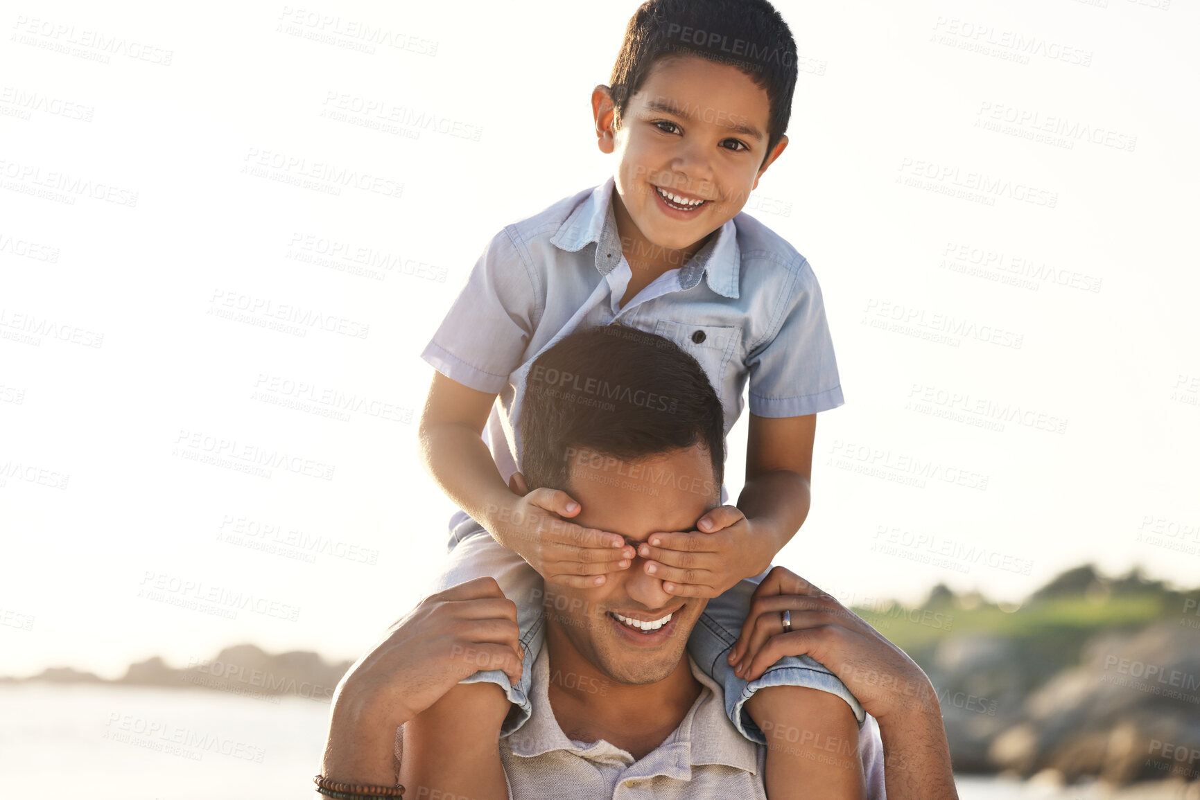 Buy stock photo Beach, family and child of shoulder of father with hands cover eyes for bonding game, quality time and playing. Travel, family love and happy boy with dad by ocean for adventure, holiday and vacation