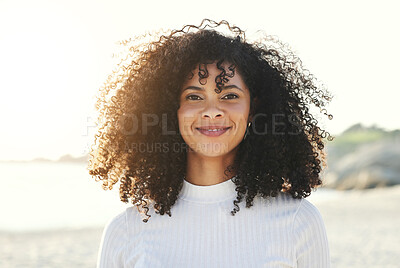 Buy stock photo Black woman, face and portrait at beach for vacation, freedom and smile with natural hair and beauty. Happy young model person outdoor in nature for peace, travel and time to relax on sunset holiday