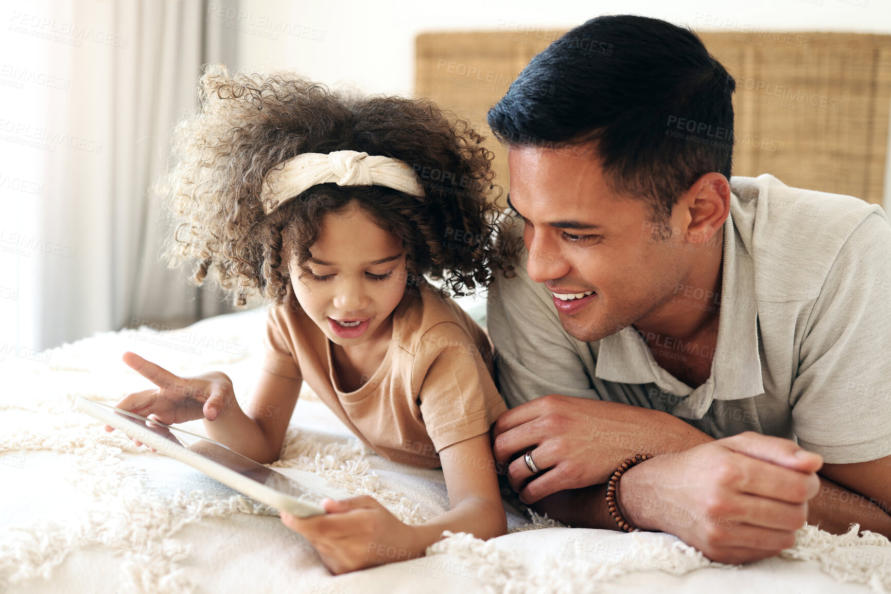 Buy stock photo Child learning, tablet and father teaching for online development, home education and relax on bed. Dad or black man with kid on digital app technology for internet game, helping and bonding together