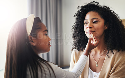 Buy stock photo Happy, makeup and lipstick with mother and daughter for bonding, playing and affectionate. Care, happiness and relax with black woman and child in family home for cosmetics, relax and grooming
