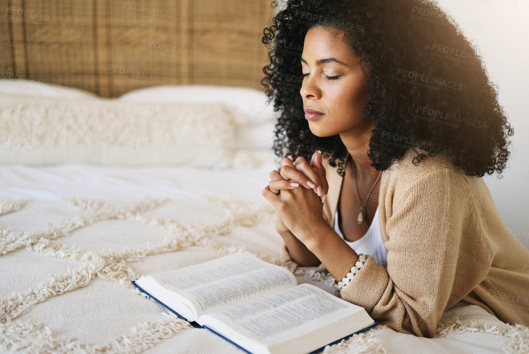 Buy stock photo Bible, prayer and black woman praying on bed in bedroom home for hope, help or spiritual faith. God, christian and female worship Jesus or Holy Spirit for forgiveness, compassion or grace in house.