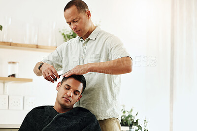 Buy stock photo Haircut, barber and man hair stylist cutting a client in a barbershop for grooming service for customer in a salon. Male, hairdresser and person gets a trim or hairdo during appointment
