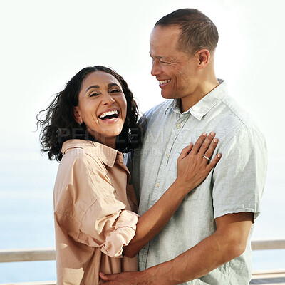 Buy stock photo Portrait, laughing and senior couple by beach, hug and enjoying quality time on holiday or vacation. Love, comic and retired happy man and woman laugh at funny joke or comedy while having fun by sea.