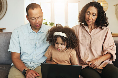 Buy stock photo Child streaming a movie on laptop with her grandparents while relaxing on sofa in the living room. Technology, rest and girl watching video or film with grandfather and grandmother for entertainment.