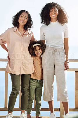 Buy stock photo Portrait, black family or children with a senior woman, mother and daughter standing outdoor together on a balcony or veranda. Mothers day, love or kids with a girl, parent and grandparent outside