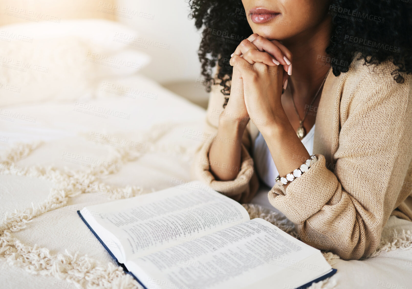 Buy stock photo Bible, prayer and hands praying for hope, religion or help, spiritual or faith in home. God, christian and female or woman worship Jesus Christ or Holy Spirit with catholic text or book for peace.