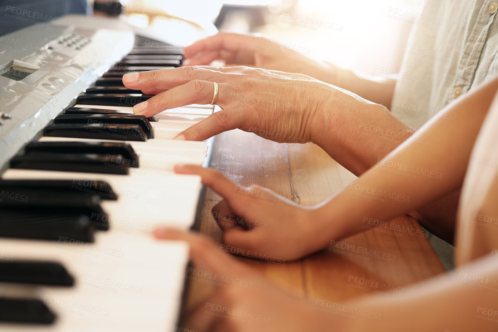 Buy stock photo Piano, learning and hands of kid with father in home, playing or bonding together. Development, education and parent teaching child how to play musical instrument, acoustic and electric keyboard.