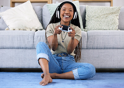 Buy stock photo Black woman, gaming and smile with controller by living room sofa for fun match or online game at home. Happy African American female playing video games with headphones for entertainment or esports