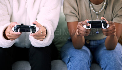 Buy stock photo Woman, hands and friends gaming with controller on living room sofa in competitive match or game at home. Women playing video games in competition or esports sitting on lounge couch for entertainment