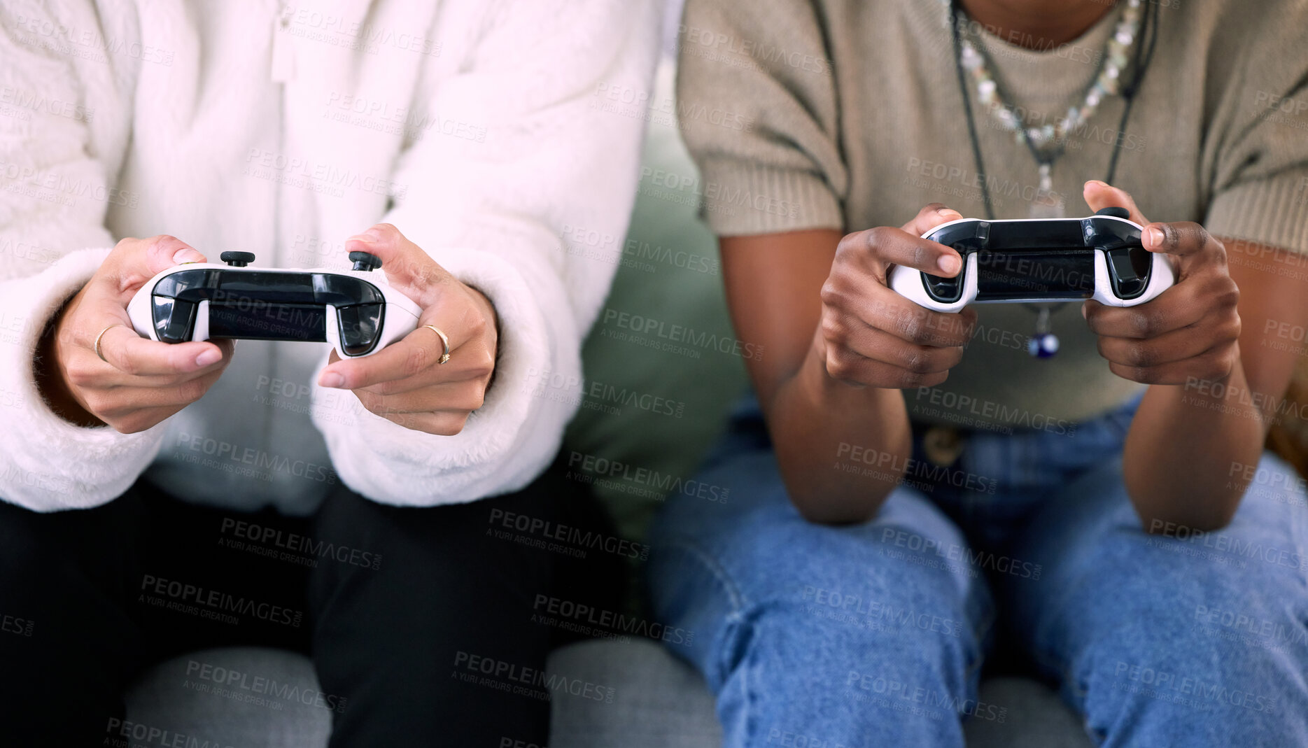 Buy stock photo Woman, hands and friends gaming with controller on living room sofa in competitive match or game at home. Women playing video games in competition or esports sitting on lounge couch for entertainment