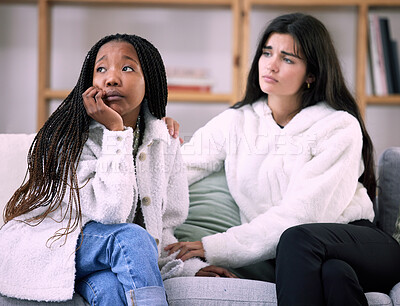 Buy stock photo Sad, friends and worry with women on sofa in living room for comfort, grief and depression. Mental health, emotional support and care with girl consoling at home for solidarity, advice and sympathy