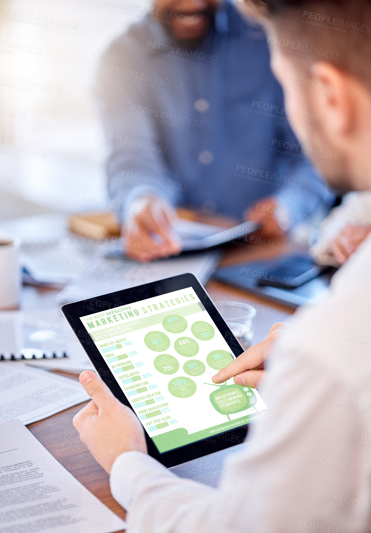 Buy stock photo Marketing, strategy and a tablet in the hands of a business man during a meeting in the boardroom. Graphic, illustration and statistics with a male employee doing research while planning at work