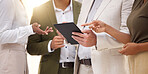 Hands, tablet and collaboration with a business team working on research together in their office. Teamwork, meeting or planning with a man and woman employee group discussing strategy at work