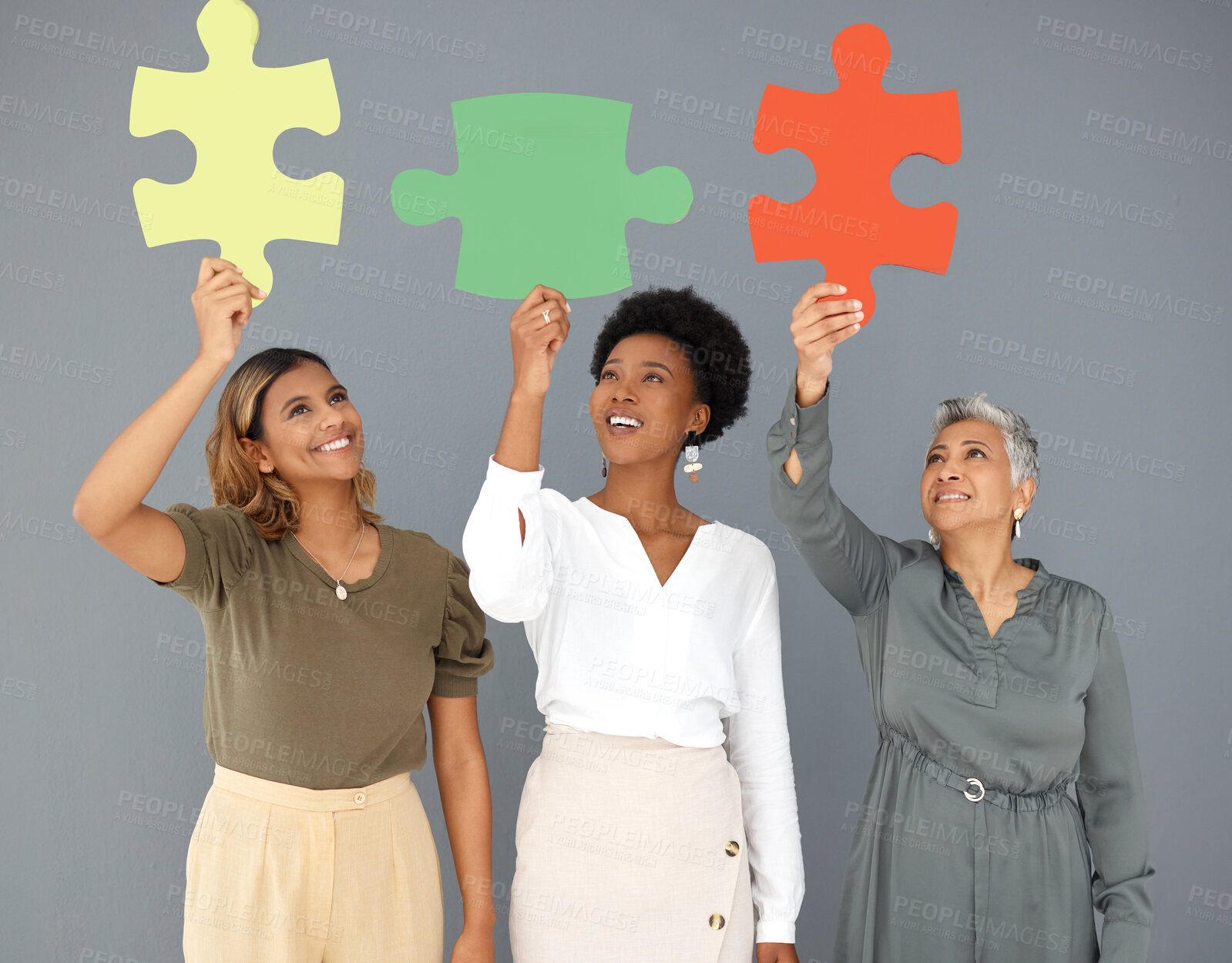 Buy stock photo Business people, puzzle pieces and synergy, connection and smile with diversity on studio background. Problem solving, link and working together with teamwork and cooperation with women in corporate 