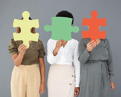 Buy stock photo Teamwork, jigsaw puzzle and business people together for collaboration, innovation and solidarity. Entrepreneur women hold color icon in hand for connection, creativity and solution to solve or join