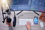 Microphone, person hands and podcast studio, computer screen and stock market news, radio or audio update. Mic, sound technology and reporter on pc monitor for broadcast, trading and statistics above