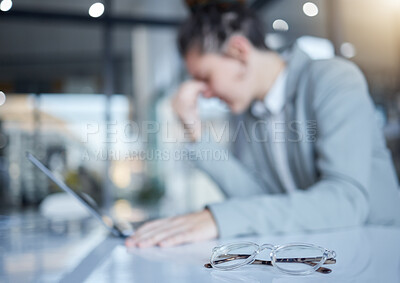 Buy stock photo Woman, headache and glasses in office with laptop, blurred background and space for mockup with stress. Burnout, eye care problem and overworked girl with computer, pain and frustrated in workplace